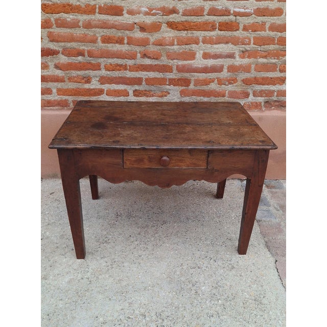 A charming rustic louis xv period coffee table, made in the 18th century, likely from solid walnut. A distinctive piece...