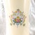 This is a nine inch vase by Royal Doulton in the Juliet pattern from 1982. The vase is white with a multicolor floral...