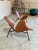 Modern sculpted lounge chairs called Kram chairs designed by Thomas Pedersen. Inspired by an open sea shell, these wide,...