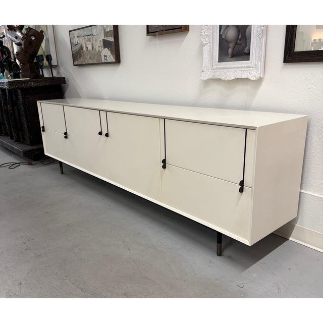 A stunning white lacquered credenza by Tyler Hays for his firm BDDW of New York. If you’re familiar with his firm they...