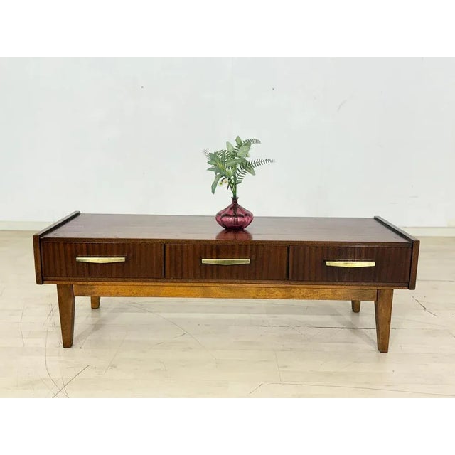 For sale is a beautiful mid-century lowboard from the 1960s. The simple, timeless design is enhanced by elegant brass...
