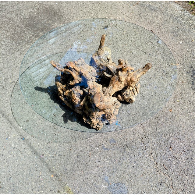 Elevate your living space with this stunning nature inspired coffee table. This one of a kind piece features a quarter...