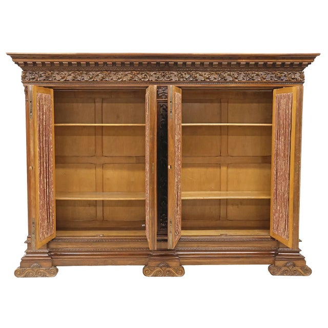 Gorgeous Antique Bookcase, Italian Renaissance Revival, Carved Walnut, Iron Doors, C. 1900 A substantial and beautifully...