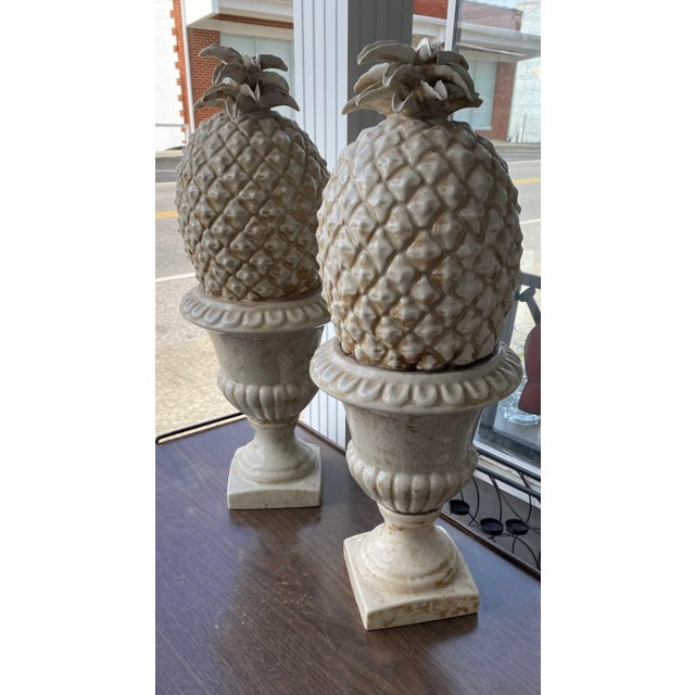 Urn Pineapple Topiaries in a nice Glazed Finish of White and Tan Color standing at Two Feet Tall this Pair of Pineapple...