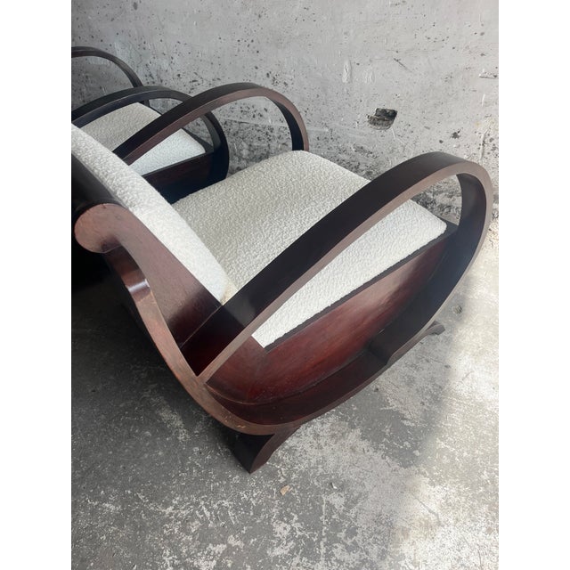 Introduction This elegant pair of Art Deco club chairs showcases a sculptural design with beautifully curved wooden...