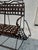 Authentic antique wrought iron garden bench with a beautiful openwork structure, fully preserved in its original patina....
