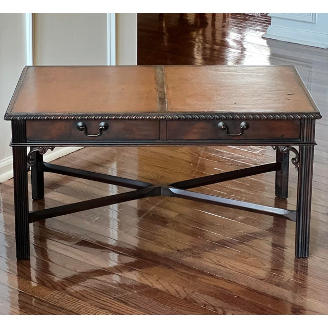 Stately mahogany Chippendale stye coffee table by Imperial of Grand Rapids, c. 1940s. A great table featuring a dual panel...