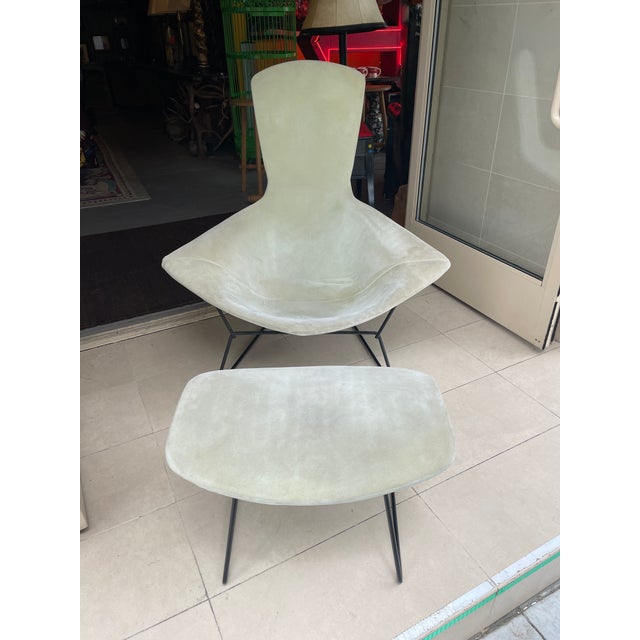 This is an iconic Harry Bertoia bird chair and ottoman. It is truly on elf the most conformable chairs ever designed.