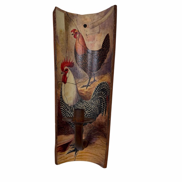 This item is a vintage-style decorative wall sconce candle holder featuring rooster artwork painted on a curved,...