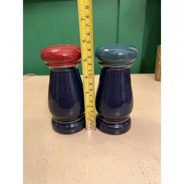 Handcrafted Denby Harlequin blue, green and red salt and pepper shakers. Made in England. The salt shaker has one hole and...