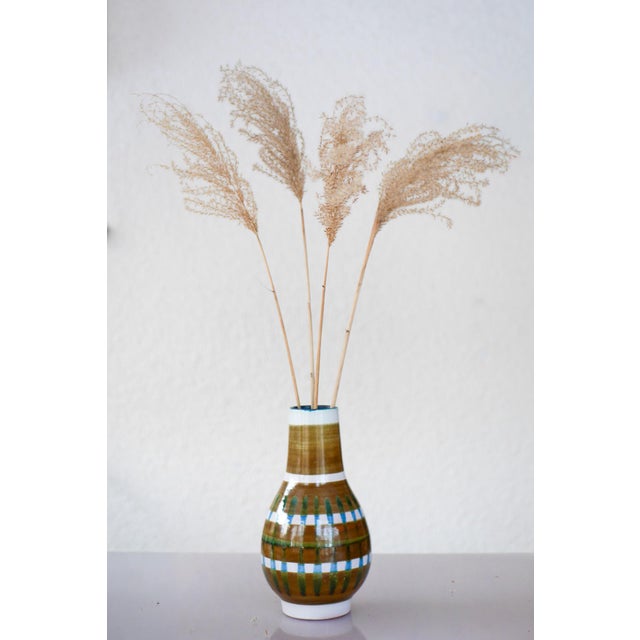 A rare and handmade ceramic vase from the celebrated “faenza” series, designed by ingrid atterberg for upsala ekeby,...