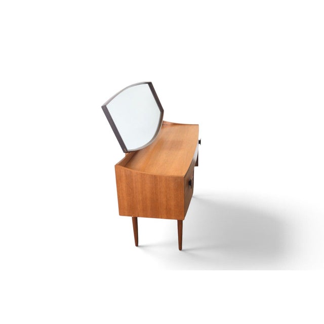 This "Danish Range" vanity was designed by Ib Kofod Larsen and produced by G Plan in England in 1961. The case combines...