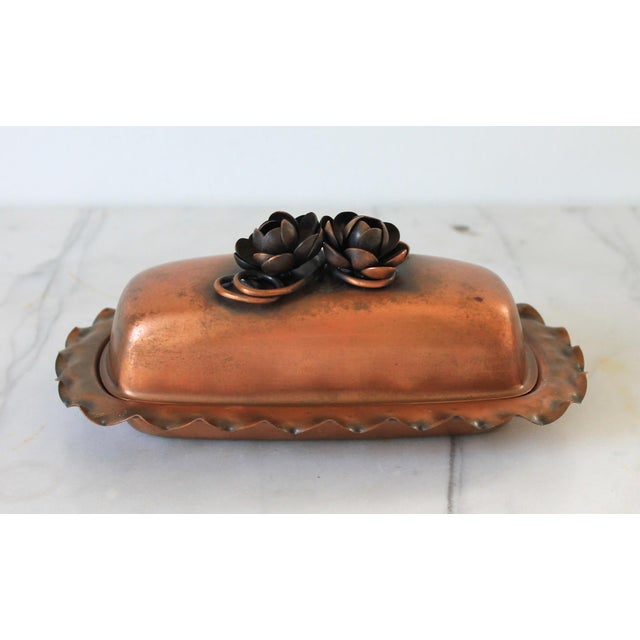 Vintage Gregorian copper lidded butter dish with floral motif and scalloped edges. Makers mark on the bottom. Does not...