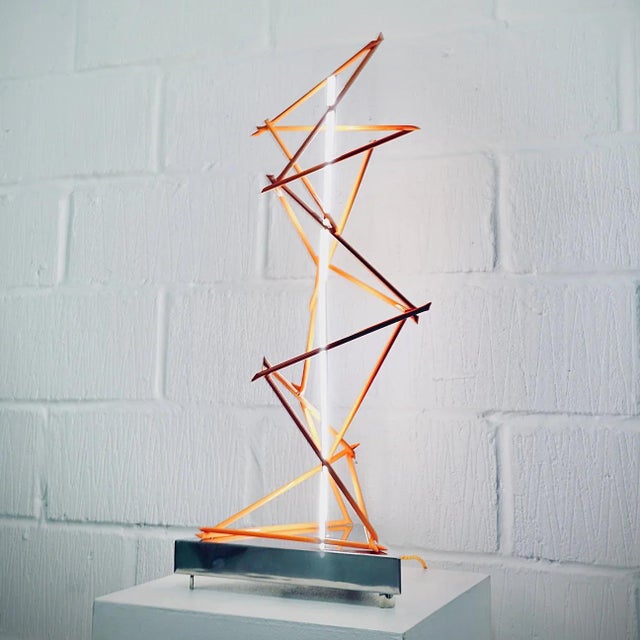 Mark Beattie, Orange Fracture, 2023 Powder coated copper & dimmable LED light on mirror polished stainless steel plinth 35...