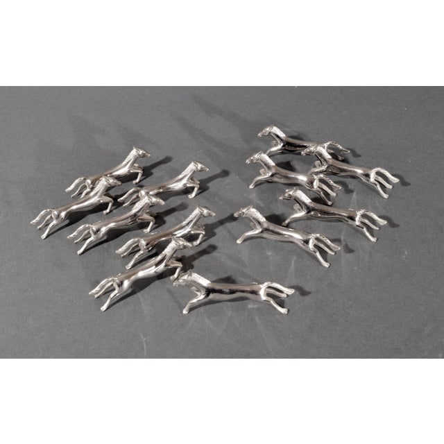 Set of Twelve Silvered Metal Equestrian Knife Rests Mid-century Modern A charming and well-modelled set of twelve knife...