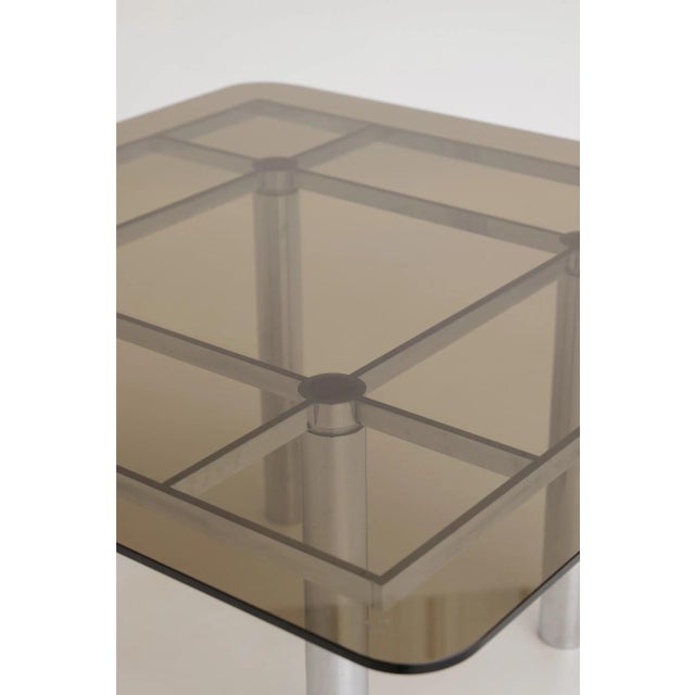 Andre dining table designed by Afra and Tobia Scarpa and produced by Knoll International. Model with a square smoked glass...