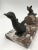 An adorable early Art Deco figure of a fox chasing a duck whilst jumping over a hay barrel. Spelter on red veined marble.