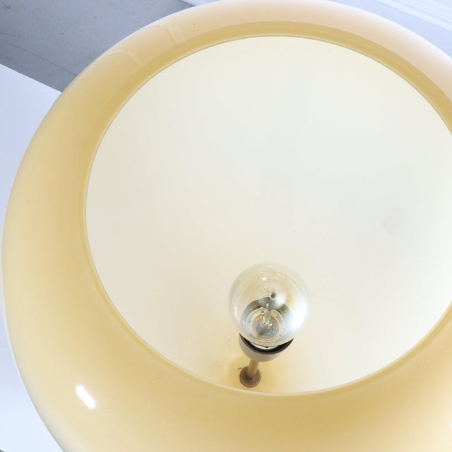 Oversized biomorphic Italian blown glass balloon lamp with a rarely seen attached glass base. A pale amber tint lets off...