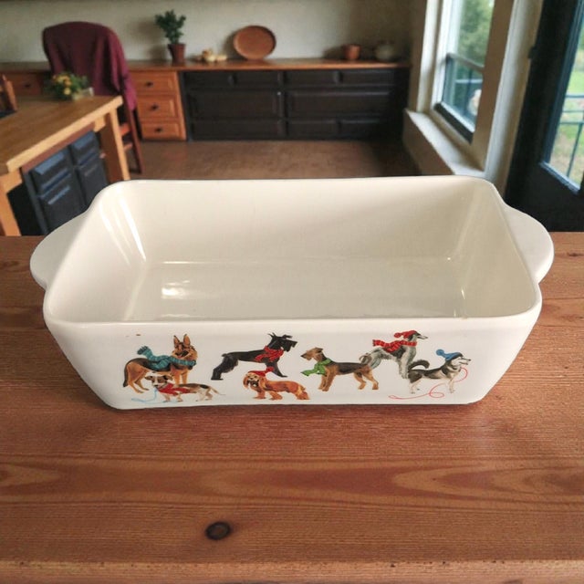 The Ceramica Cuore Ceramic Winter Dogs Casserole Serving Dish is an original and collectible bakeware piece made in Italy....