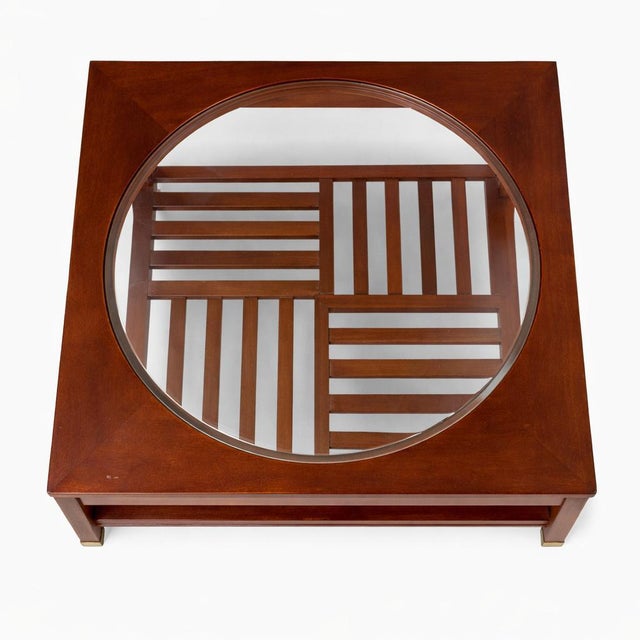 A beautifully crafted square coffee table by Stickley , made from solid cherry and featuring a striking inset plate-glass...
