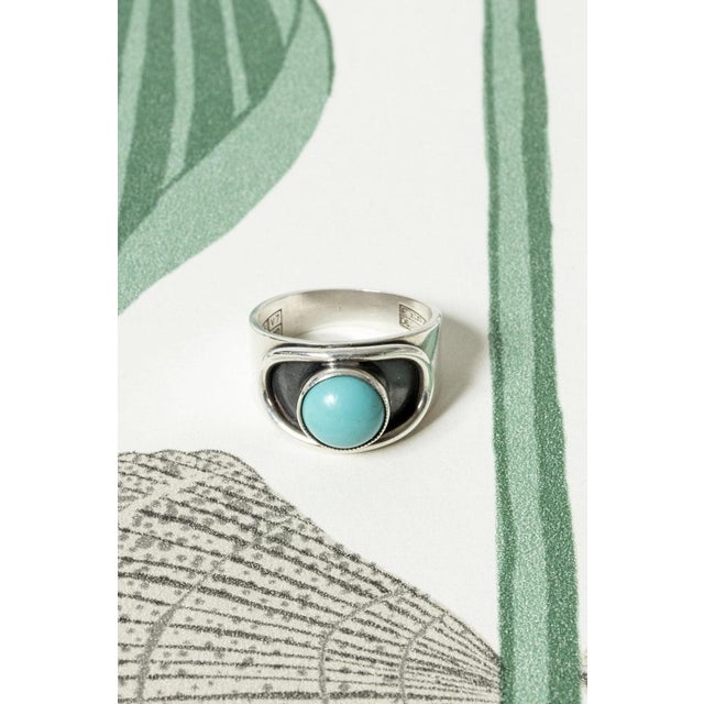 Neat silver ring from Erik Granit, with a round turquoise stone. A perfect summer ring, easy to wear. Weight 6 grams. This...
