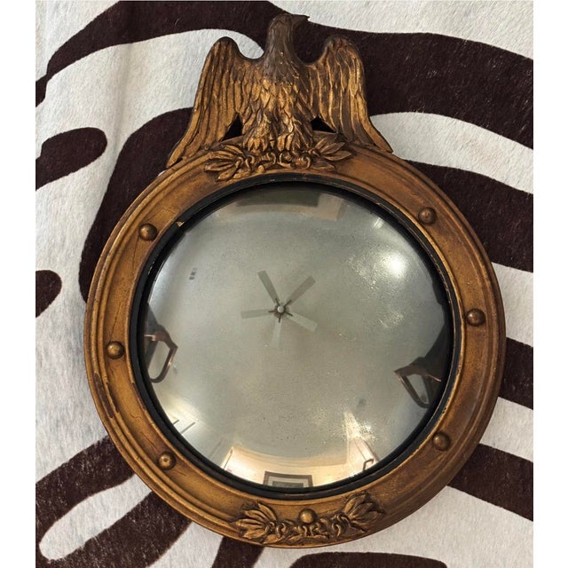 Handsome antique Federal Revival convex, naturally-aged mirror with a warm, timeworn gilt finish and restrained scale....