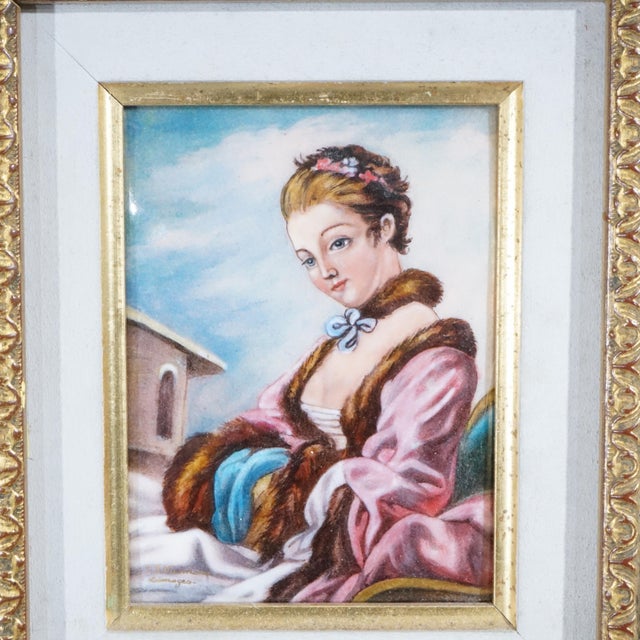 A French Limoges painting offers enamel on copper portrait of a woman in outdoor setting, seated in giltwood frame, 20th...