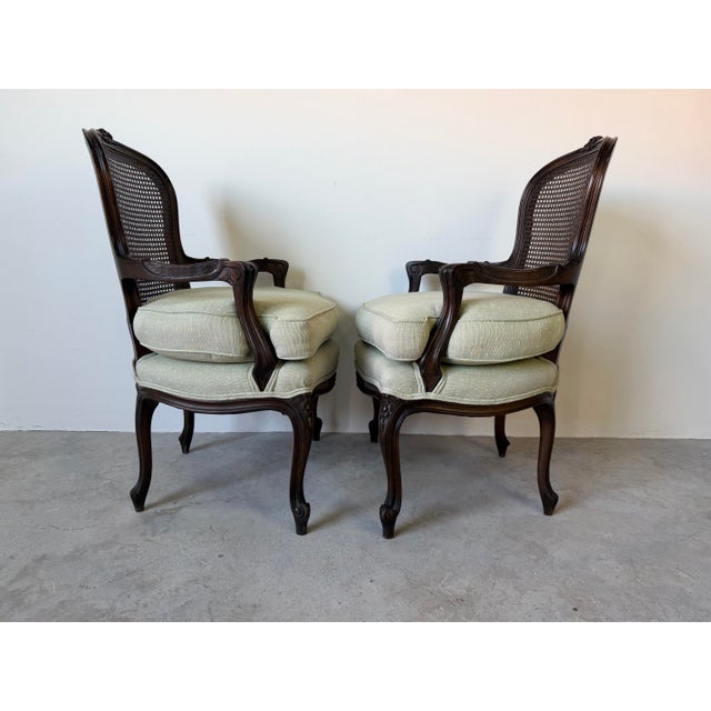 1970s Vintage French Louis XV Style Carved Walnut & Cane Back Arm Accent Chairs – A Pair For Sale - Image 5 of 12