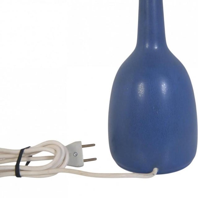 Palshus blue ceramic lamp. The lamp is from the 1960s, and appears in good condition with a few minor marks on the shade....