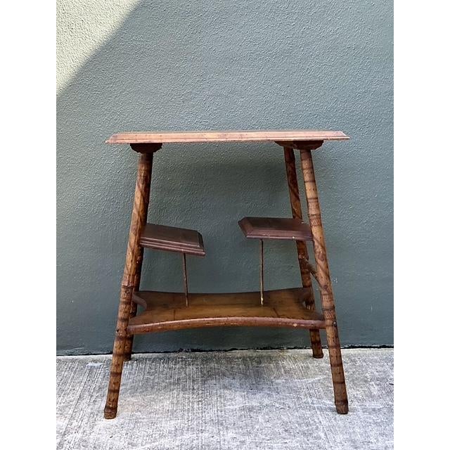 This exceptional vintage side table is a masterclass in organic texture and functional design. Crafted from scorched...