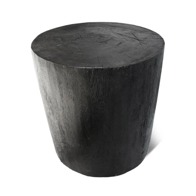 Solid heavy ebony finish wood stump stool / side table. Each is slightly unique in natural qualities. Natural grain and...