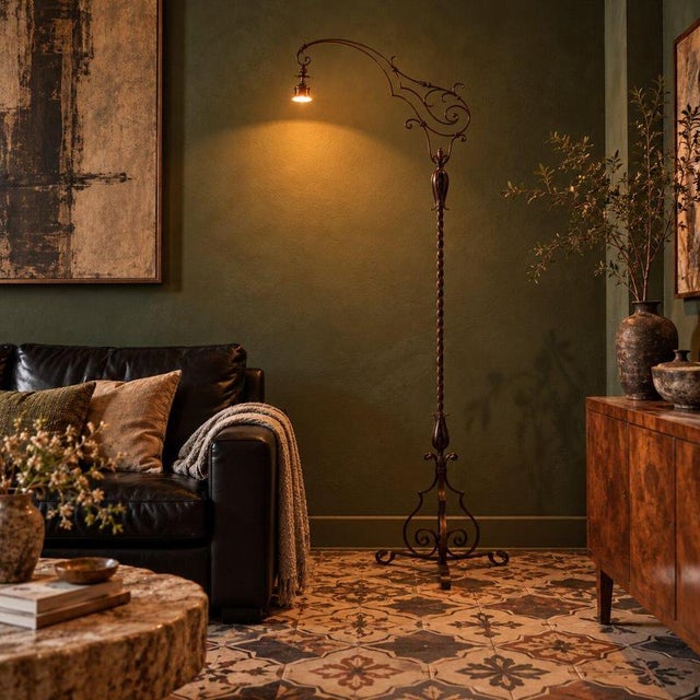 Wrought iron floor lamp featuring a twisted shaft that imparts a sense of movement and dynamism. The structure is...