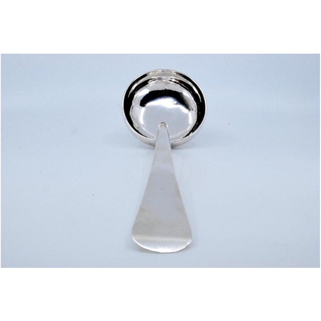 Plain Silver Soup Ladle with Handle, in Very Good conditions. Designed 1890 to 1919 This piece has an attribution mark, I...