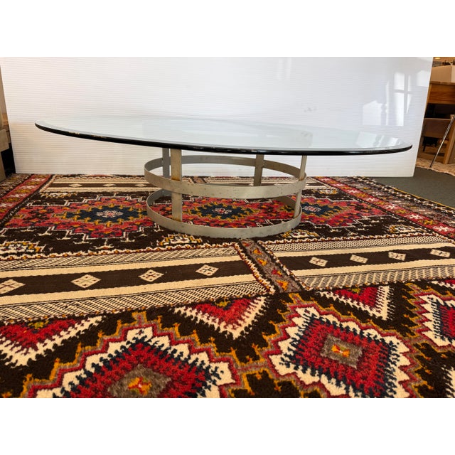 Design Plus Gallery presents a Steel Drum Coffee Table. The base anchors a wide tempered glass table top with beveled...