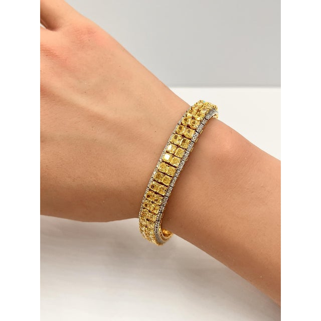 Discover opulence with our exquisite Yellow Diamond Bracelet by Iris Fine Jewelry. This luxurious piece showcases 23.56...