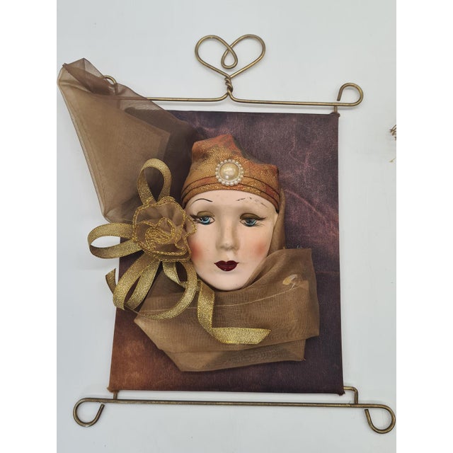 An original set of two decorative wall art pieces created using the relief technique, depicting stylized female faces made...