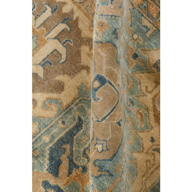 An unusual early 20th century Tabriz antique carpet from Northwest Persia, the light blue field with a lozenge lattice...