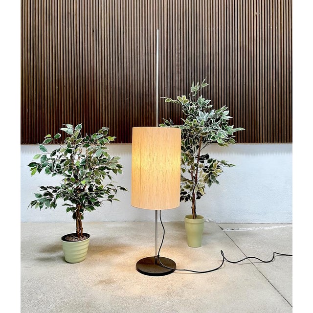 This minimalist floor lamp was manufactured in Germany during the 1960s. It was part of a hotel interior. The lamp...