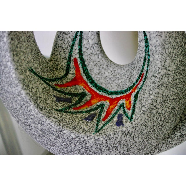 Granulated or crisp ceramic vase with grey glaze decorated with enamels in good condition This piece has an attribution...