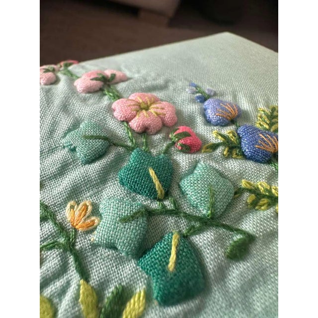 "A vivid and beautifully preserved vintage linen guest towel in a rich aqua turquoise tone, adorned with delicately padded...