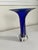 Crafted in 1991 by artist Winfisky, this exquisite signed studio art glass vase showcases a vibrant, deep cobalt blue core...