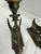 Pair Brass Late 19th Century Neoclassical Chimera candlesticks. Styled Avian head holding a candle cup, Slender torso with...