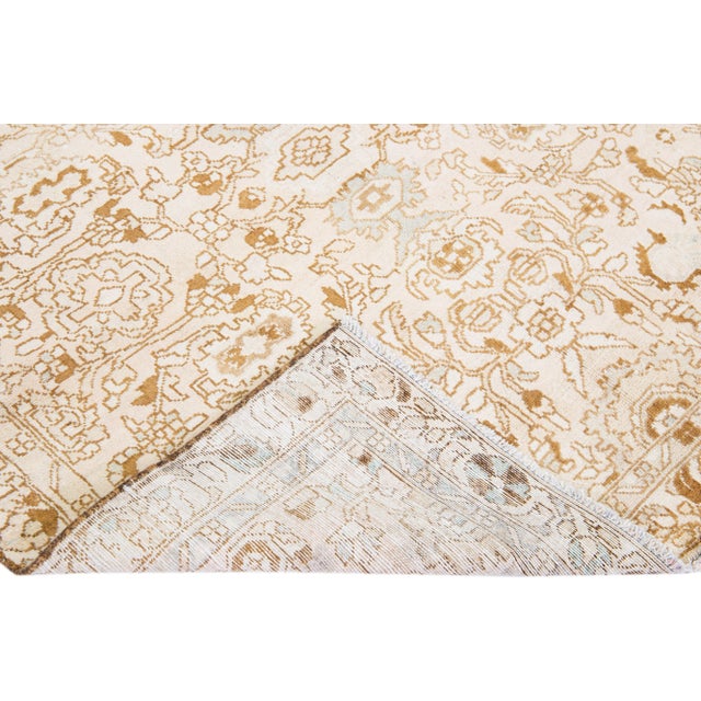 Beautiful vintage Persian Hamadan hand-knotted wool rug with a beige field. This piece has a beige frame with tan and sky...