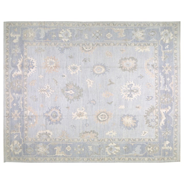 Hand-knotted with care using traditional rug making techniques, this wool rug blends timeless craftsmanship with a modern...