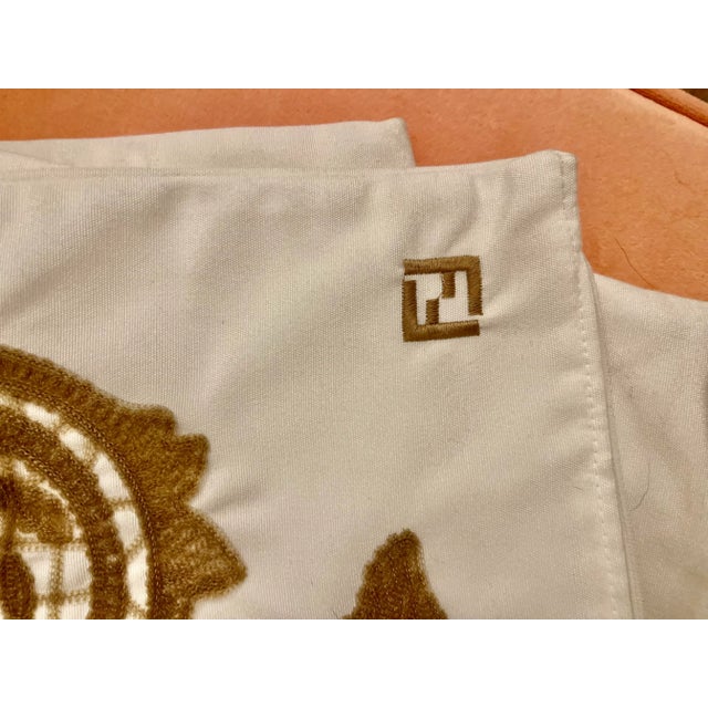 This is a stunning 19" square decorative pillow cover by Fendi. Hits white cotton with an umber embroidery pattern and the...