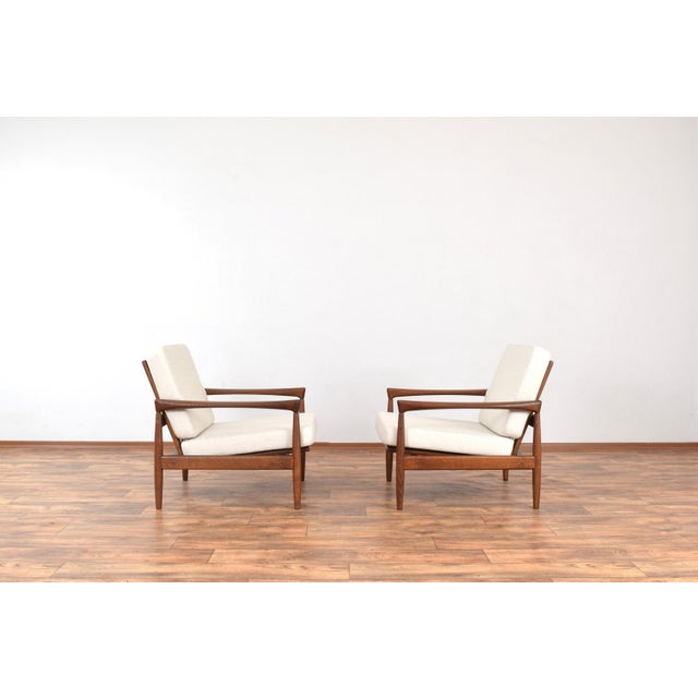 This set of two armchairs was designed in the 1960s by Erik Wørts and manufactured by IKEA in Poland. The frame of the...