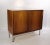 This Danish design cabinet with sliding doors is made of light mahogany and was produced in the 1960s.