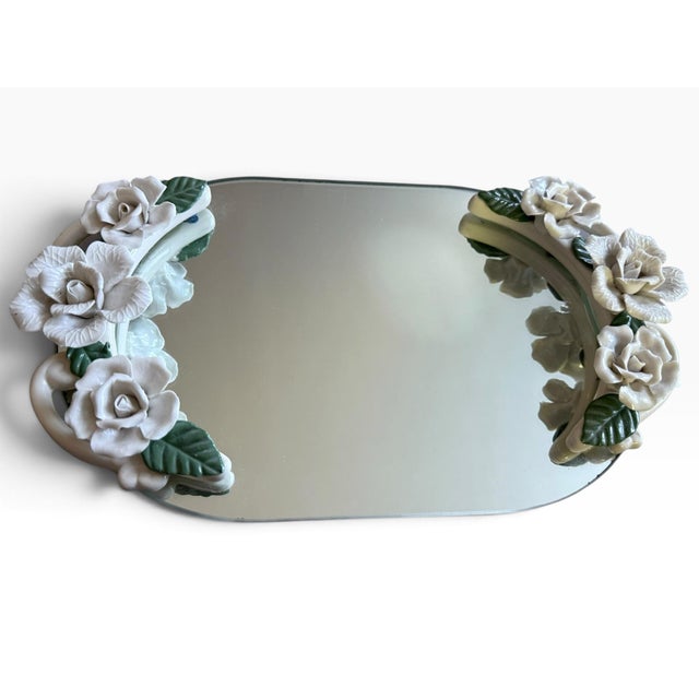 Beautiful vintage Studio Silversmiths mirrored vanity tray featuring an elaborate arrangement of dimensional white...