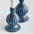 Made of a highfired, durable stoneware, a ribbed pattern and finished with a dynamic reactive glaze, these candle stands...