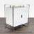 This West Elm cabinet features a clean white lacquer finish and a sleek chrome frame. Inside, it offers organized storage...